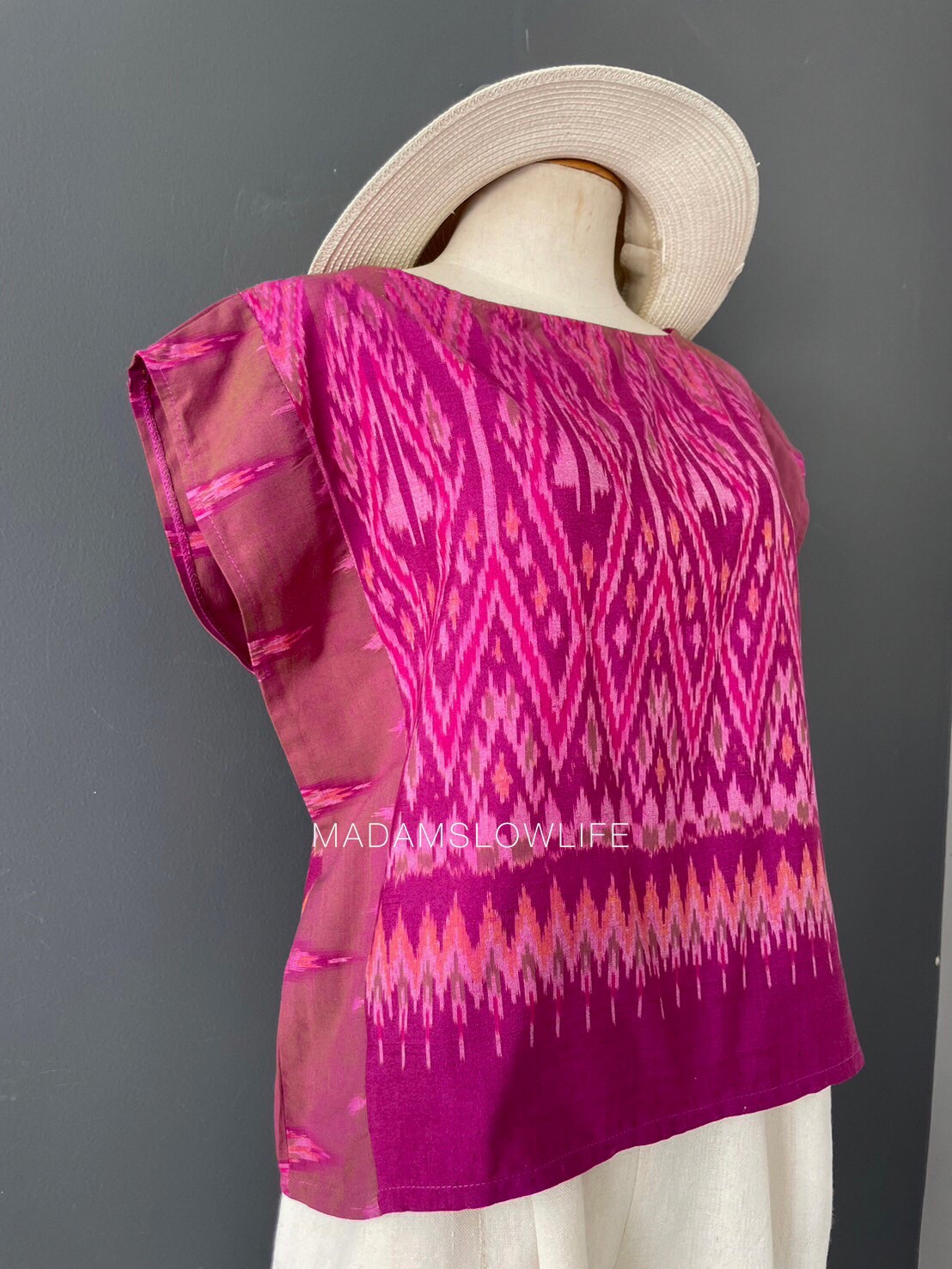 เสื้อผู้หญิง ผ้าฝ้ายมัดหมีทอมือ ลวดลายไทยโทนสีชมพูม่วง เสื้อทรงปีกผีเสื้อใส่แล้วเข้ารูปสวย